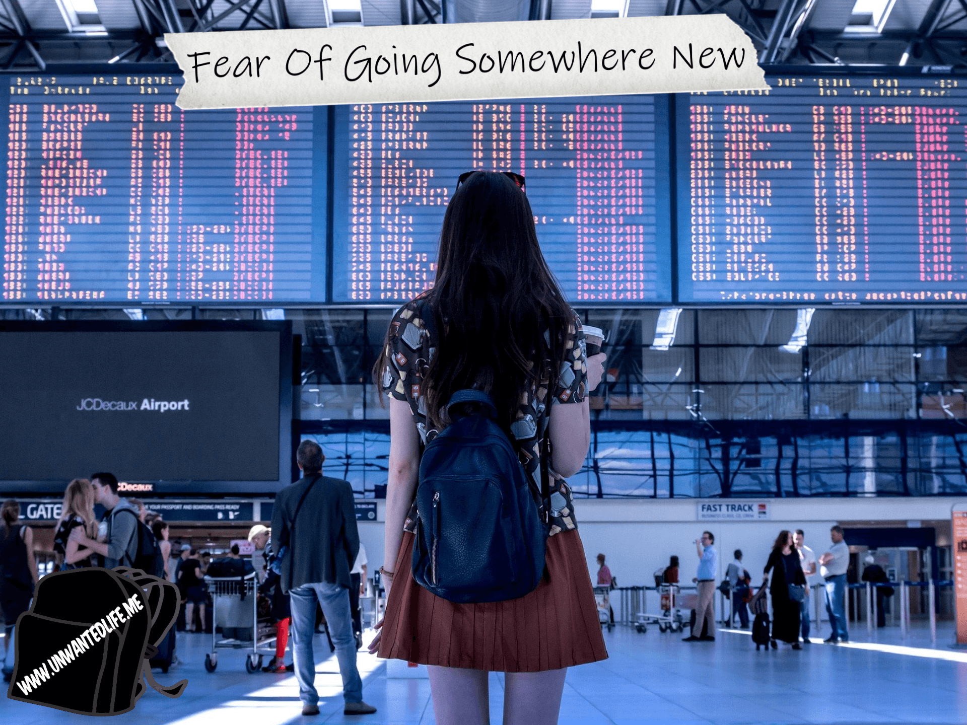 A young woman with her back to the viewer of the image, looking up as a train station arrivals board. The title of the article - Fear Of Going Somewhere New - is across the top of the image