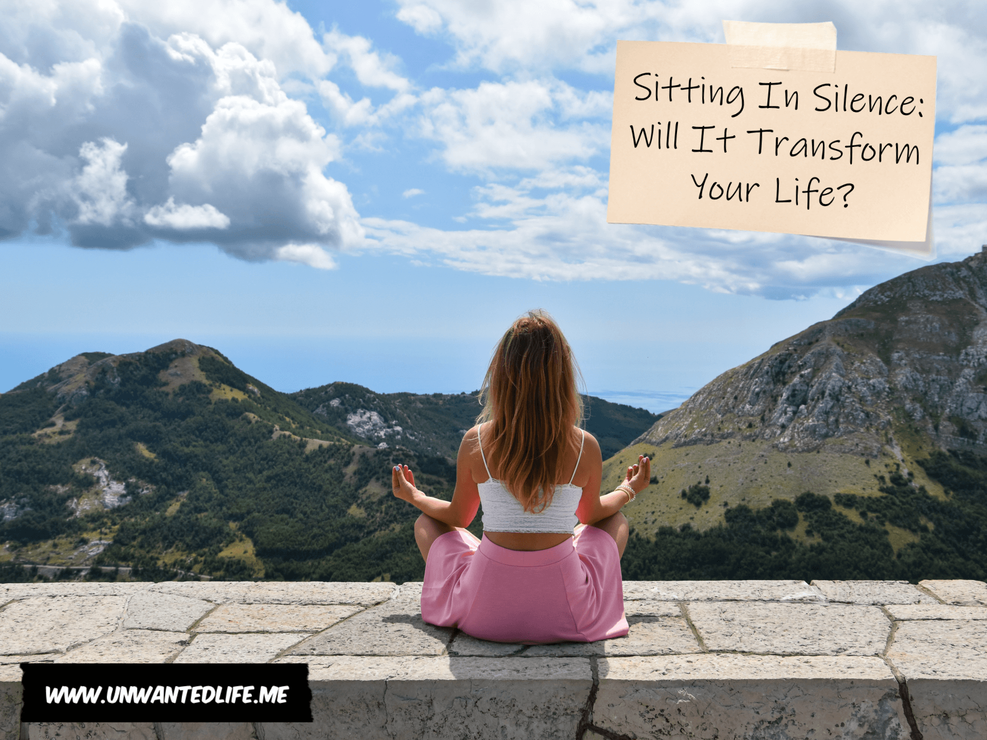 A photo of a young white woman sitting on a wall in a yoga pose overlooking a view of the countryside and mountains with the title of the article - Sitting In Silence: Will It Transform Your Life - in the top right corner of the image