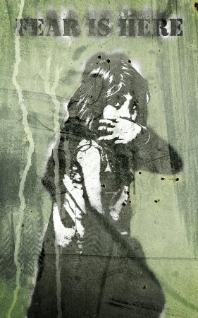 A stencilled graffiti image of a little girl trying to protect herself with the words "Fear is here" above her to represent the topic of the article - What Is Domestic Abuse? Advice And Information