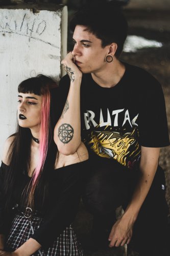 A photo of a Goth couple sitting together to represent the topic of the article - Alternative Subcultures: Goths And Mental Health