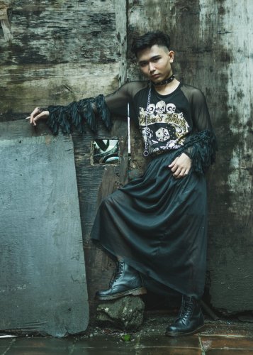 A photo of an Asian man dressed as a Goth in Dr Martin boots and a full length skirt to represent the topic of the article - Alternative Subcultures: Goths And Mental Health