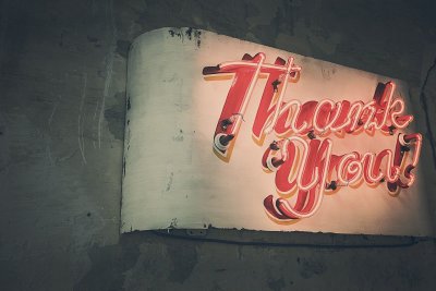 A neon sign that says "Thank You"