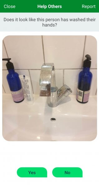 A screenshot taken from Tomo showing a photo of a bathroom sink to be judged on if it proves the Tomo user washed their hands