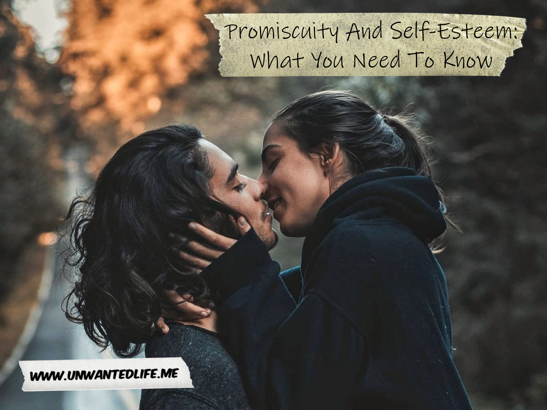 A photo of two people of Indian subcontinent heritage kissing on an autumn day to represent the title of the article - Promiscuity And Self-Esteem: What You Need To Know