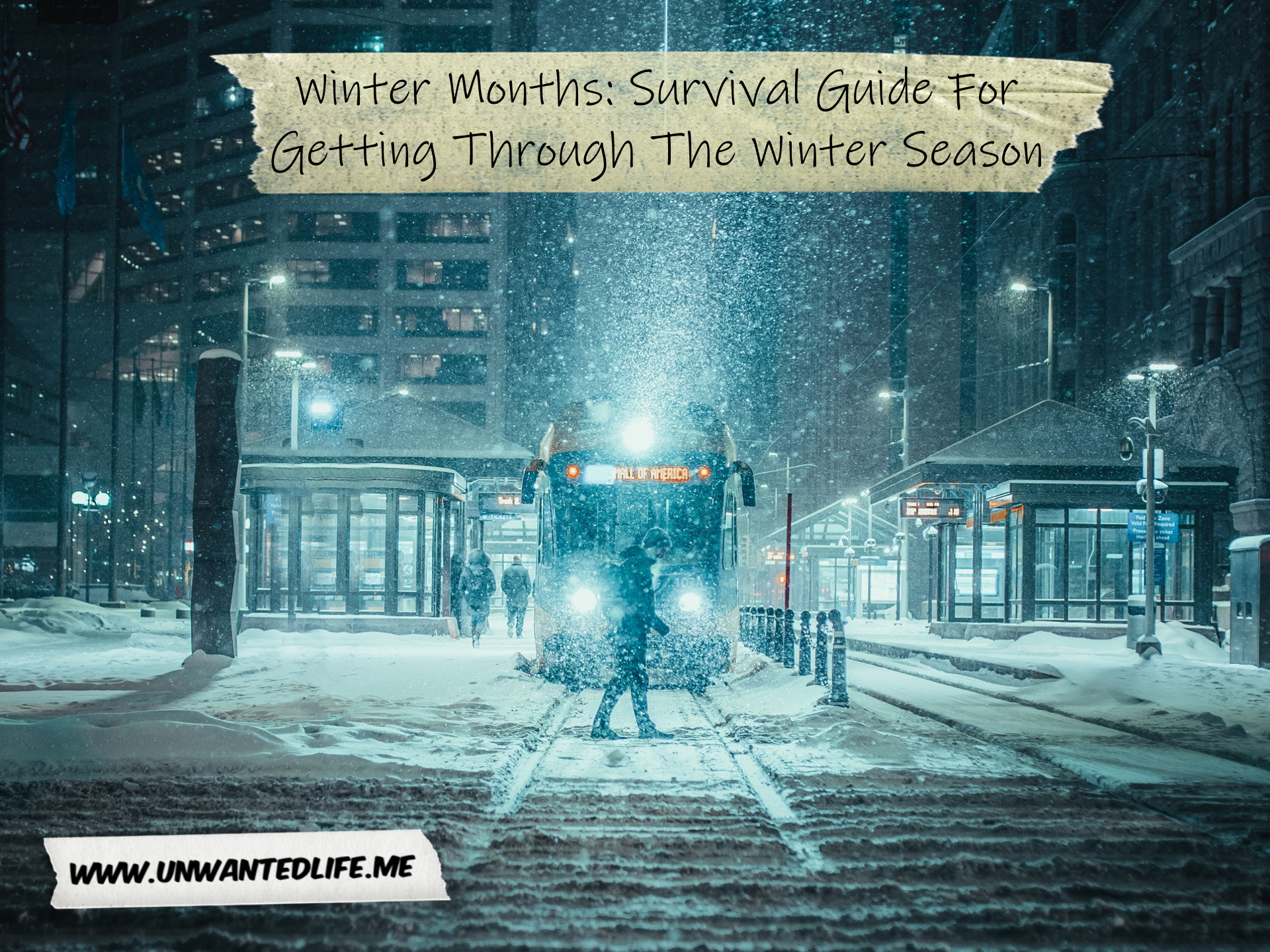 A photo of a very cold and snowy city as a person walks in front of a bus to represent the topic of the article - Winter Months Survival Guide For Getting Through The Winter Season
