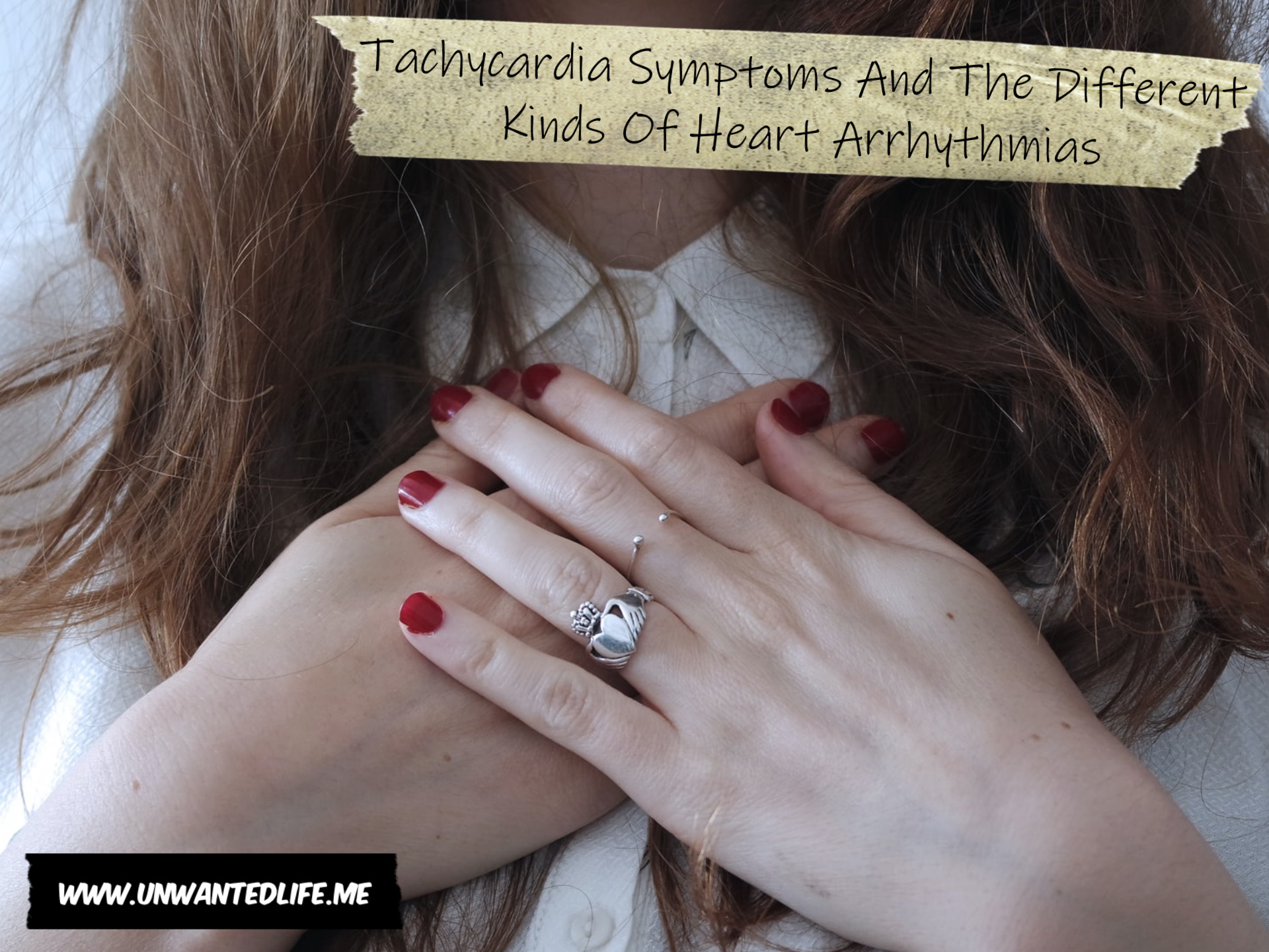 A white woman holding her hands to her chest while wearing a heart shaped ring on her finger to represent the topic of the article - Tachycardia Symptoms And The Different Kinds Of Heart Arrhythmias
