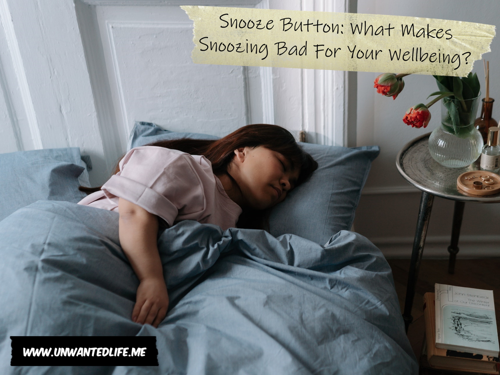 A photo of an Asian woman with dwarfism sleeping in bed to represent the topic of the article - Snooze Button: What Makes Snoozing Bad For Your Wellbeing?