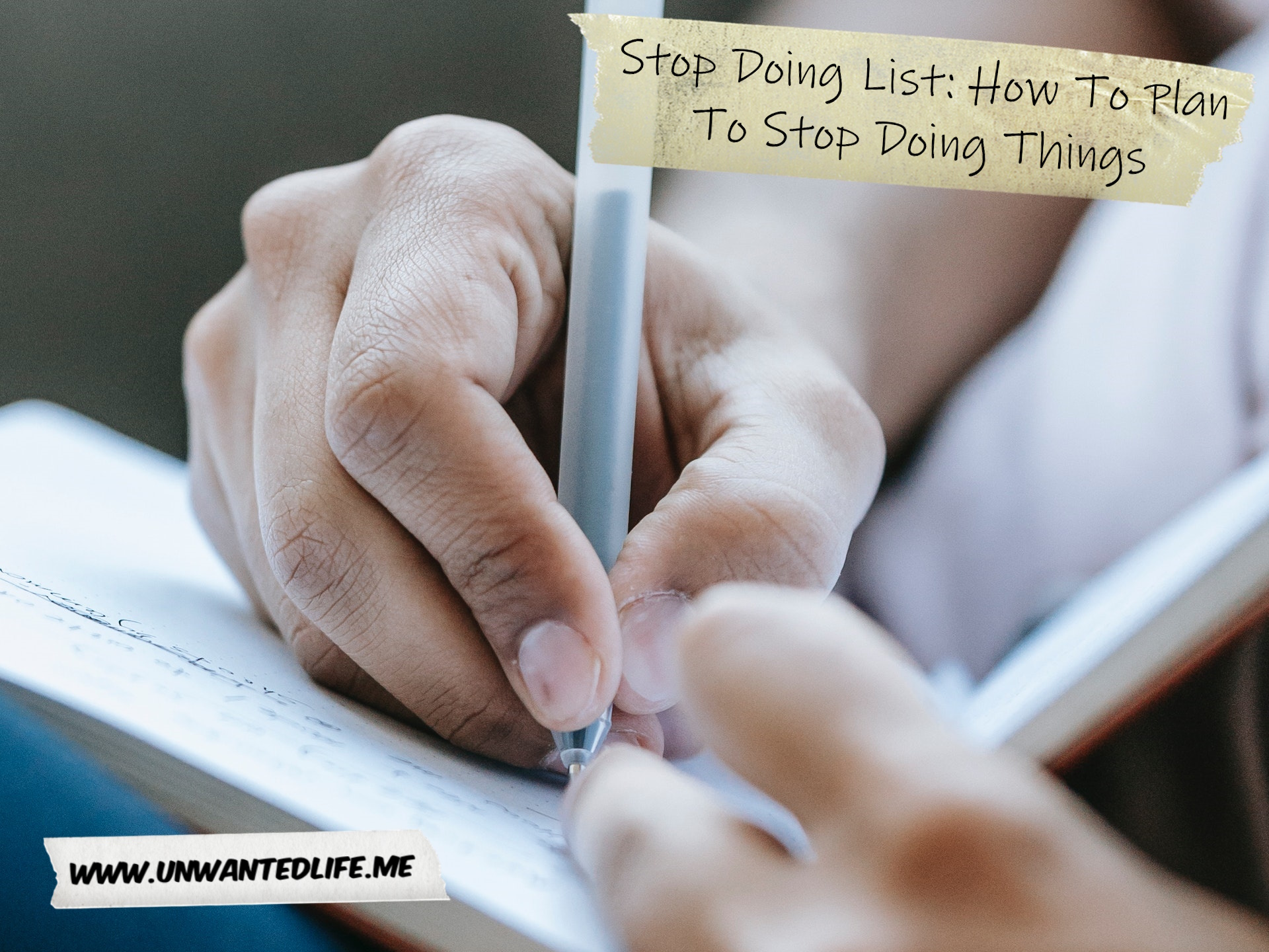 A photo of light brown hands writing in a journal to represent the topic of the article - Stop Doing List: How To Plan To Stop Doing Things