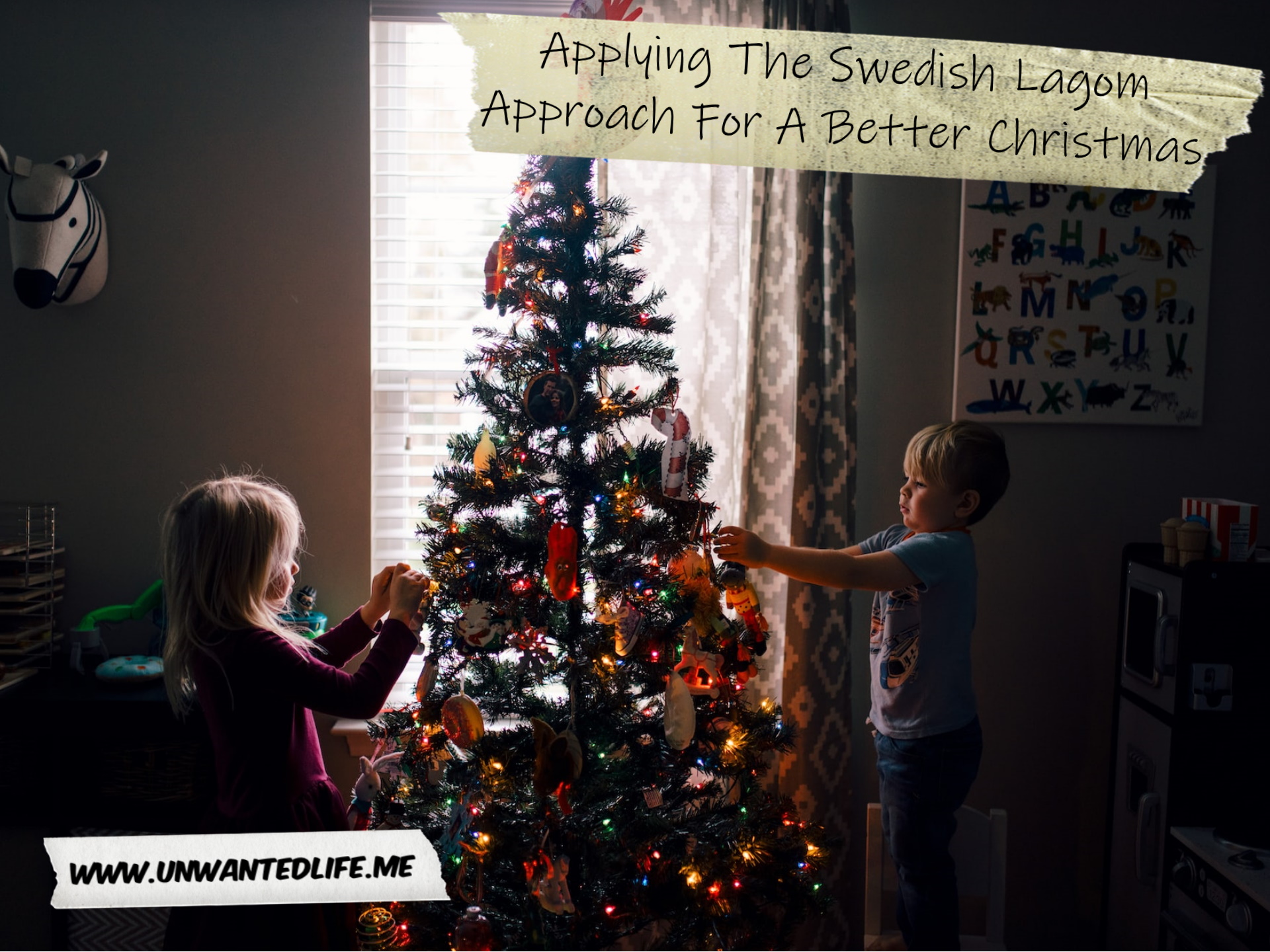 A photo of two children decorating a Christmas tree to represent the topic of the article - Applying The Swedish Lagom Approach For A Better Christmas