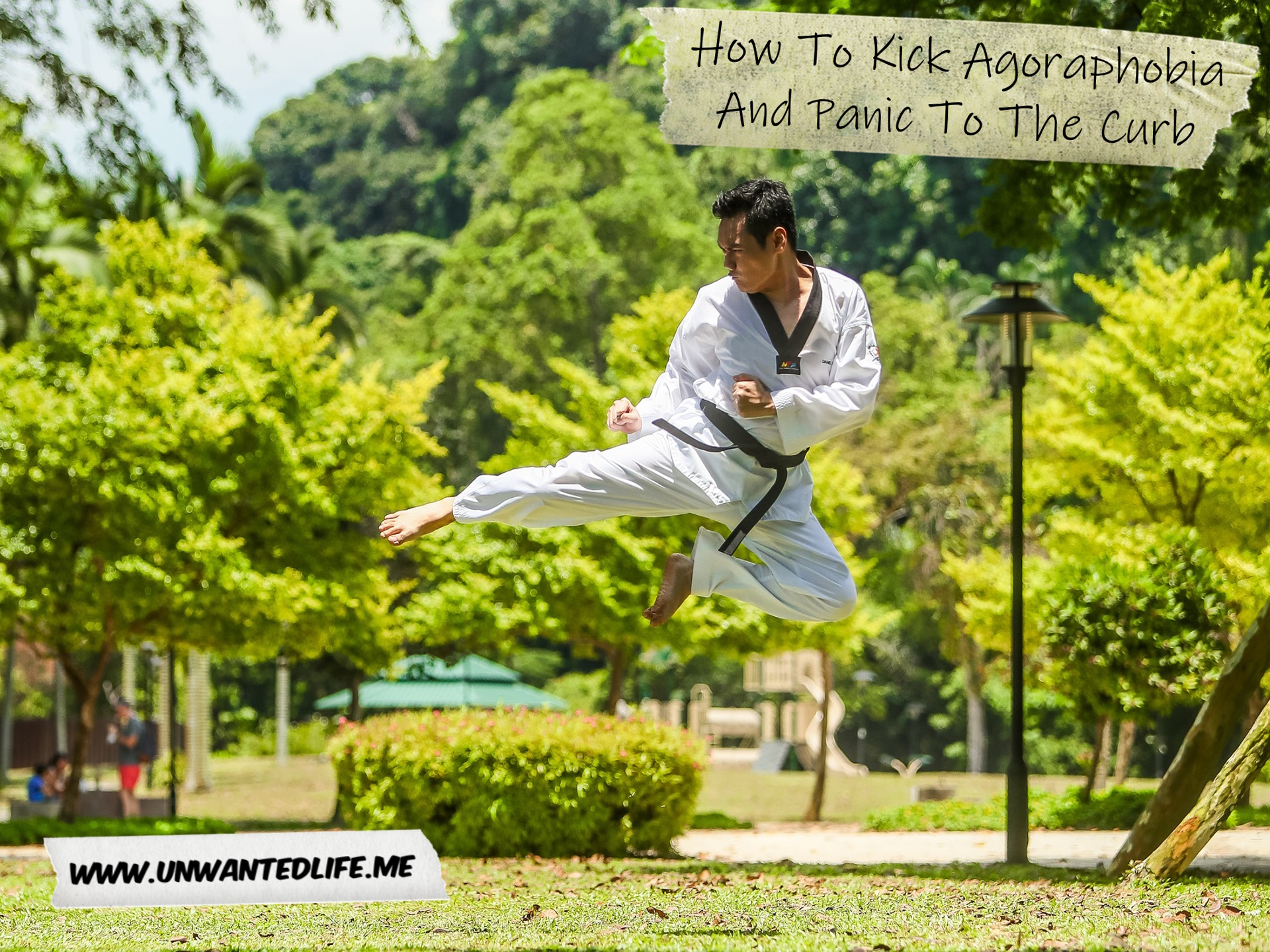A photo of an Asian man in a martial art uniform doing a flying kick in a park to represent the topic of the article - How To Kick Agoraphobia And Panic To The Curb