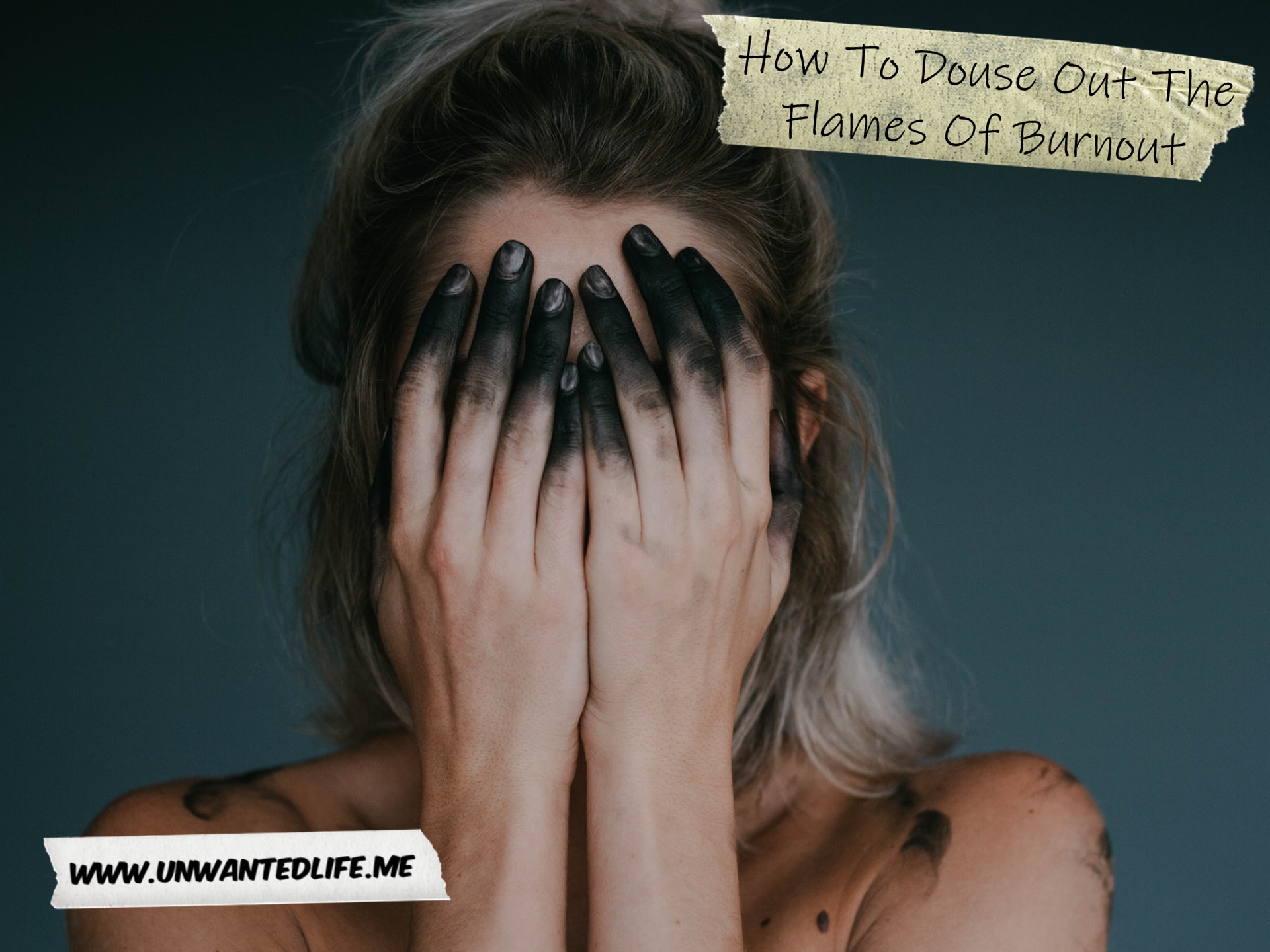 A photo of a woman with black fingers covering her face with her hands to represent the topic of the article - How To Douse Out The Flames Of Burnout