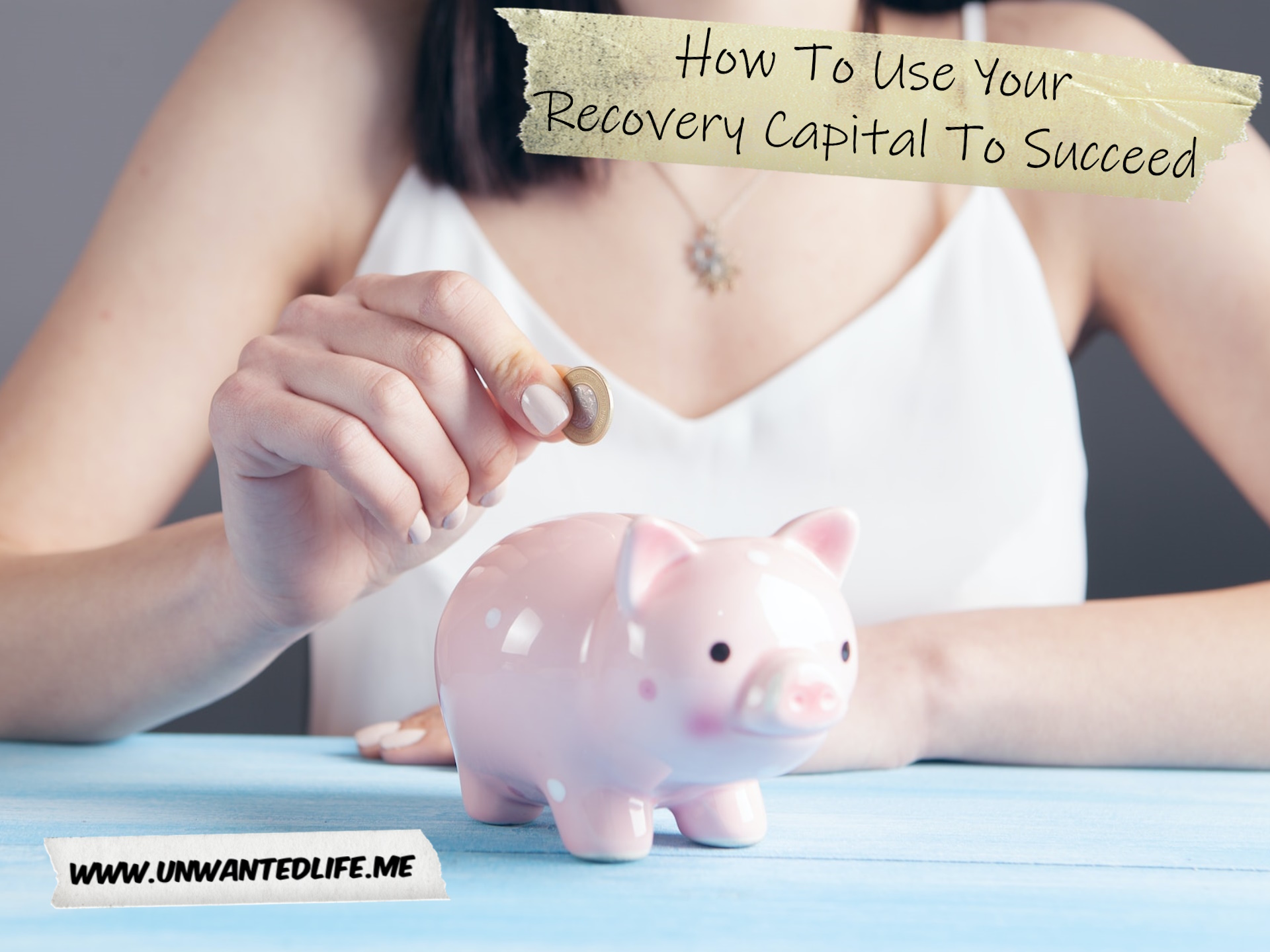 A photo of a woman putting money into a piggy bank to represent the topic of the article - How To Use Your Recovery Capital To Succeed