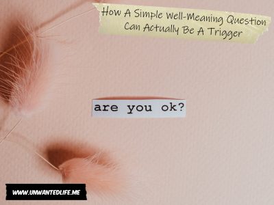 A pick background with a small piece of paper with the words "are you ok?" typed on it to represent the topic of the article - How A Simple Well-Meaning Question Can Actually Be A Trigger