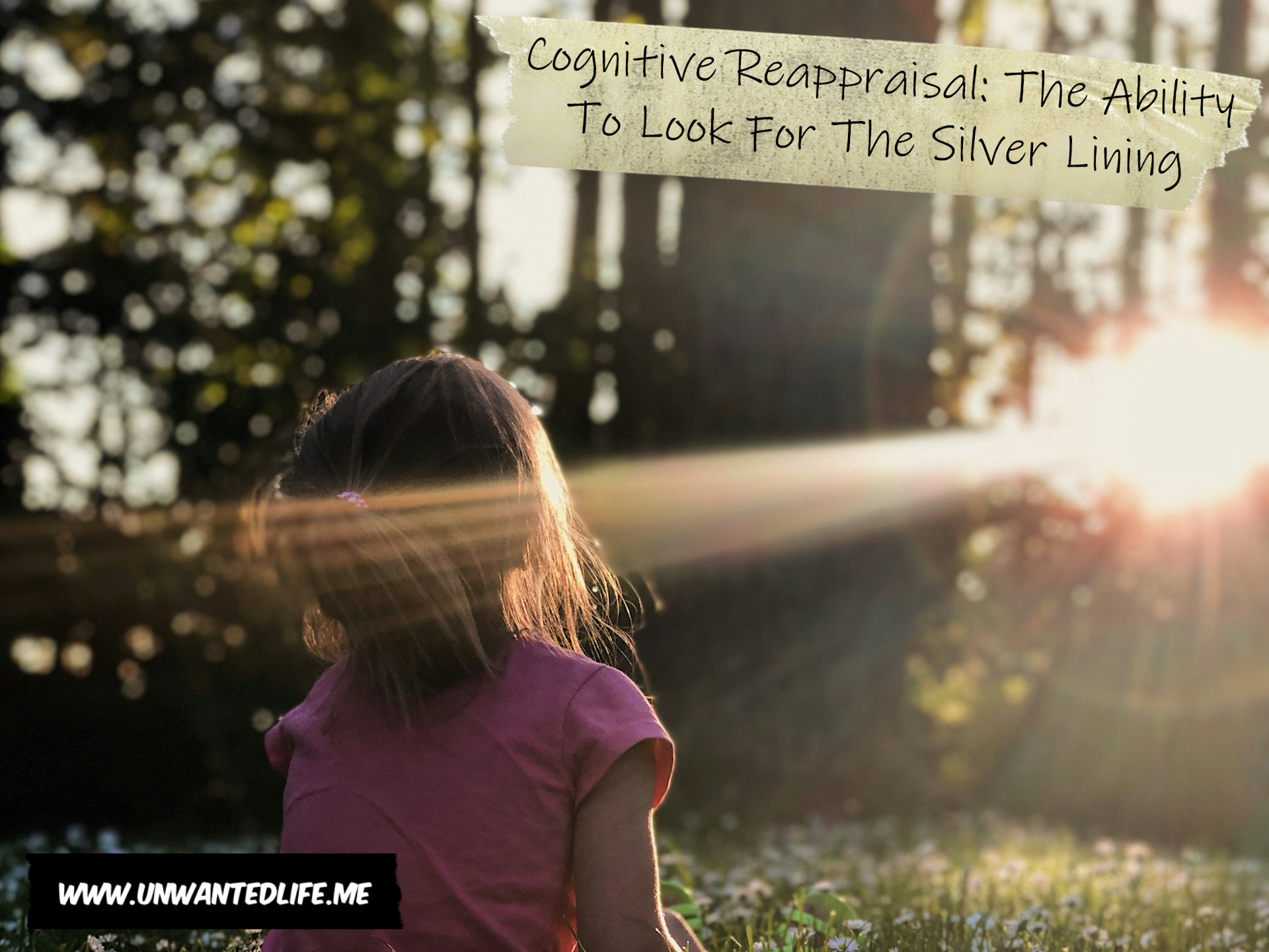 A photo of a young girl sitting in a clearing in the woods where a ray of slight shines across her face to represent the topic of the article - Cognitive Reappraisal: The Ability To Look For The Silver Lining