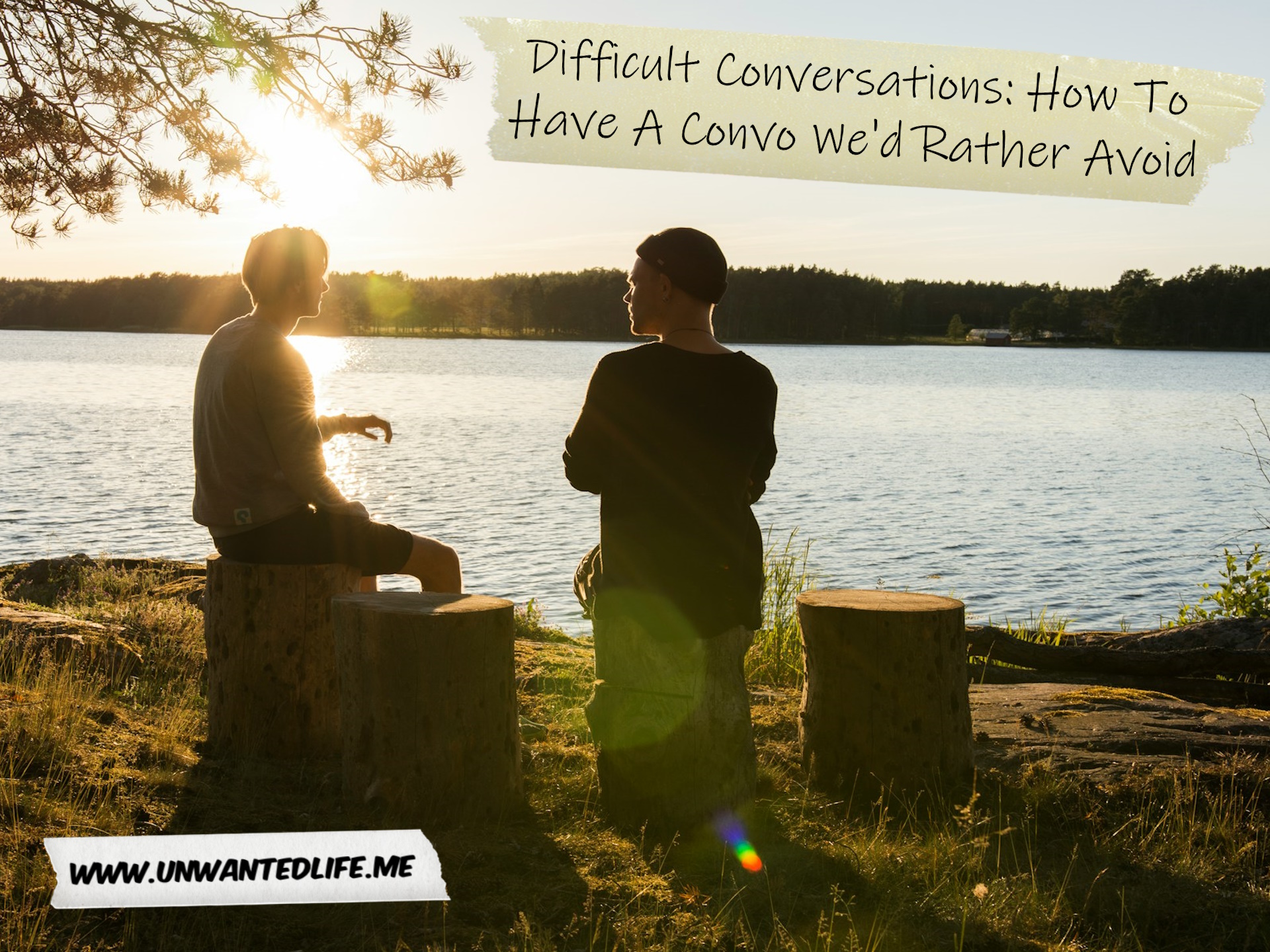 An image of two men sitting and chatting new a river to represent the topic of the article - Difficult Conversations: How To Have A Convo We'd Rather Avoid