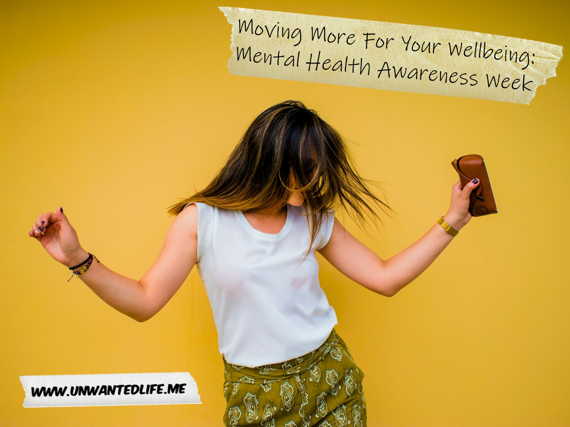 A White woman dancing to represent the topic of the article - Moving More For Your Wellbeing Mental Health Awareness Week