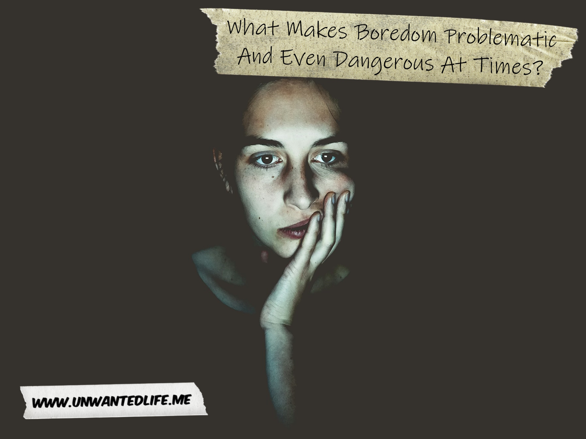 A photo of a woman sitting in the dark looking board to represent the topic of the article - What Makes Boredom Problematic And Even Dangerous At Times?