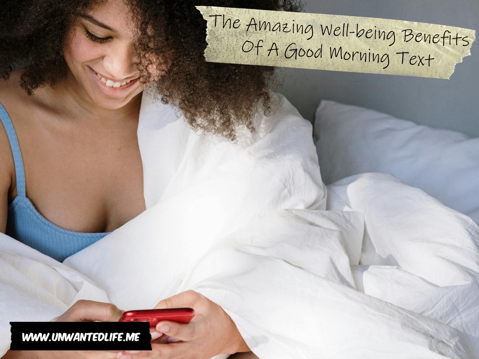 A photo of a Black woman in bed with a coffee, smiling as they read a good morning text to present the topic of the article - The Amazing Well-being Benefits Of A Good Morning Text