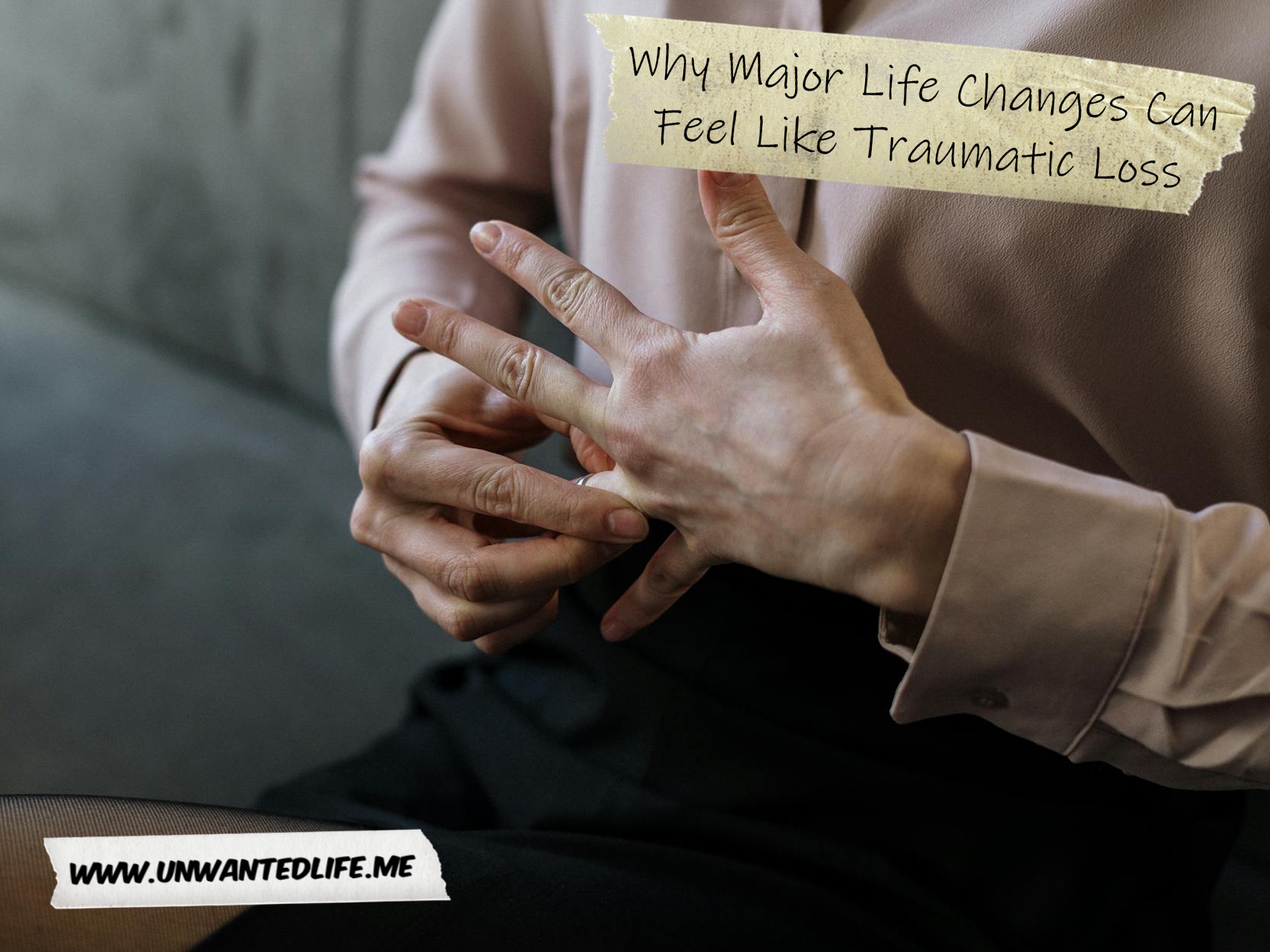 A photo of a woman removing her wedding banned to represent the topic of the article - Why Major Life Changes Can Feel Like Traumatic Loss