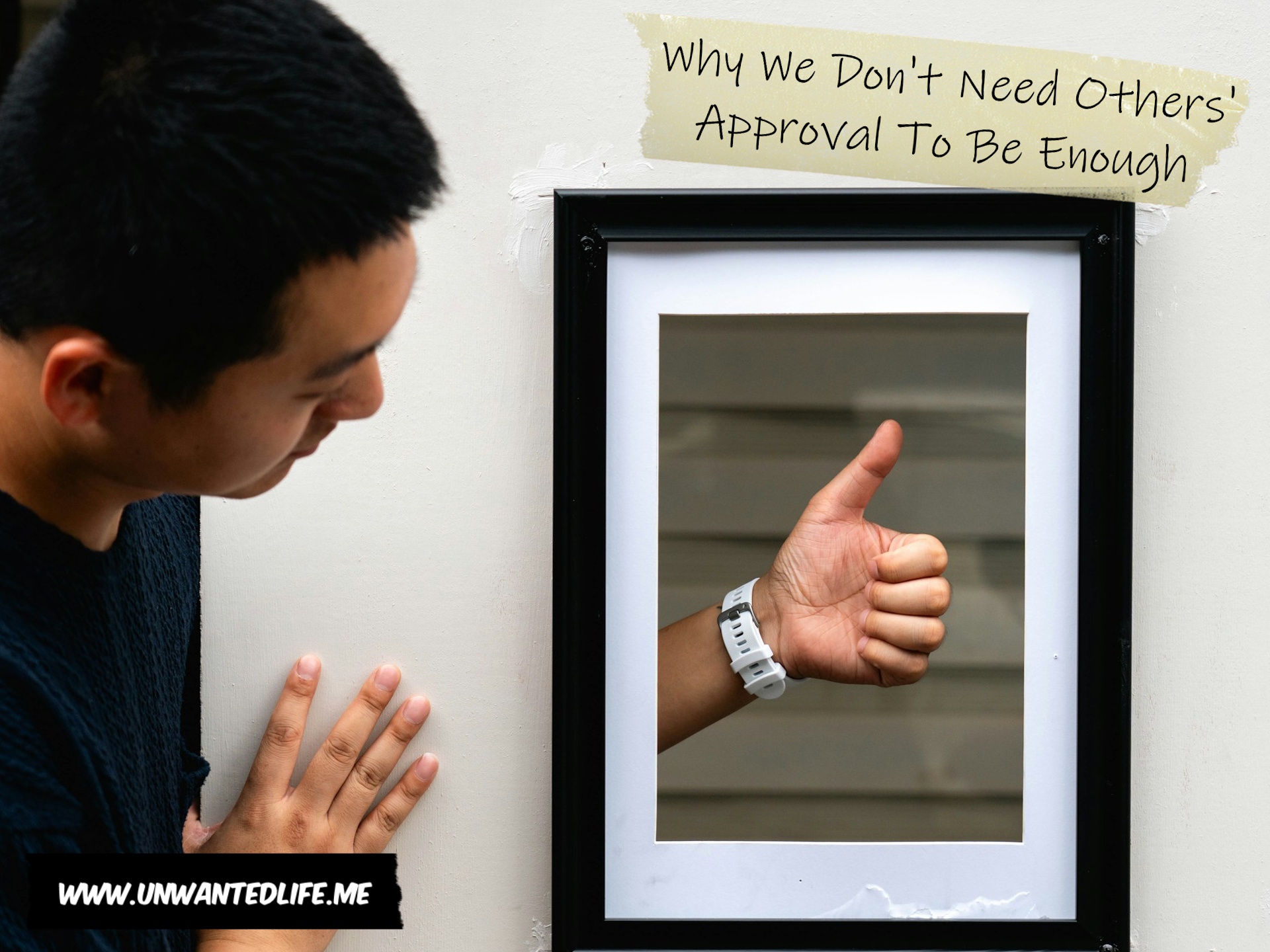 A photo of a South East Asian giving a thumbs up through a picture framed hole in the wall to represent the topic of the article - Why We Don't Need Others' Approval To Be Enough