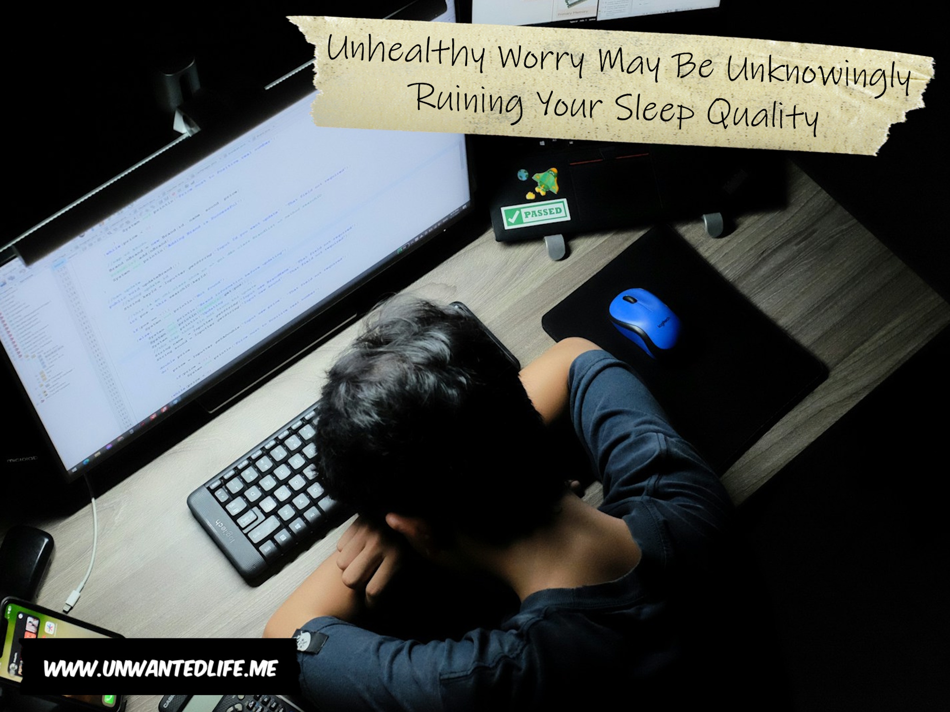 A photo of a man sleeping on his computer keyboard to represent the topic of the article - Unhealthy Worry May Be Unknowingly Ruining Your Sleep Quality